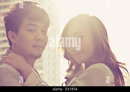 Dating young couple in love facing Stock Photo