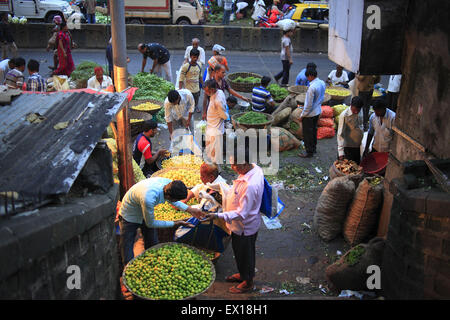 Aug. 22, 2014 - 22 aug 2014 - Mumbai, India :.The Dadar Vegetable Market at Mumbai.India, the world's largest producer of milk and the second-largest producer of fruits and vegetables, is also one of the biggest food wasters in the world - wasting 440 billion rupees worth of fruits, vegetables, and grains every year, according to Emerson Climate Technologies India, part of Emerson, a US-based manufacturing and technology company. Cold storage solutions, which are severely lacking in India, are needed to reduce spoilage, experts say.In India as much as 40 per cent of fresh produce is wast Stock Photo