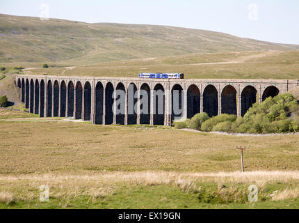 Northern Rail train crossing Ribblehead Viaduct, Yorkshire Dales national park, England, UK Stock Photo