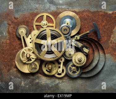 Metal collage of clockwork on rusty background Stock Photo