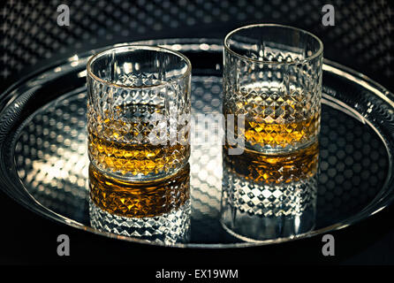 Whiskey glasses on the tray. Stock Photo