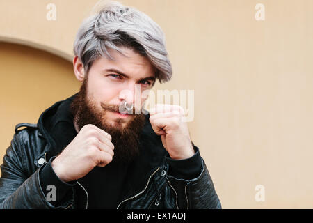 Bearded hipster with nose ring in leather jacket Stock Photo