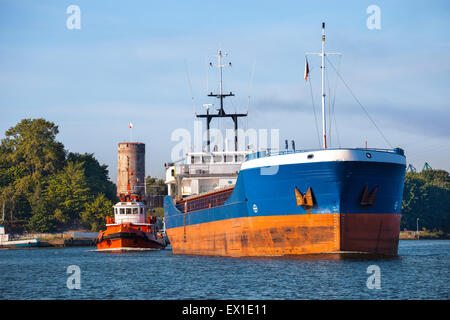 Cargo ship out of the harbor. Stock Photo