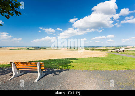 A bench overlooking beautiful landscape in the North Eifel in Germany, with view down to the rhine valley. Stock Photo