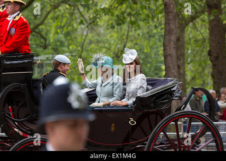 Kate Middleton, Camilla Parker Bowles, & Prince Harry in a carriage en route to the Trooping the Colour ceremony 16 June 2012 Stock Photo