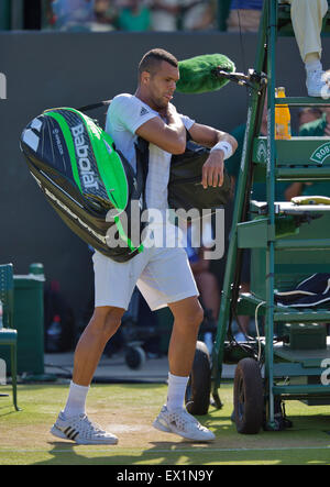 Wimbledon, London, UK. 04th July, 2015. Tennis, Wimbledon, Jo-Wilfried Tsonga (FRA) makes his way out after losing his match against Ivo Karlovic (CRO) Credit:  Henk Koster/Alamy Live News Stock Photo