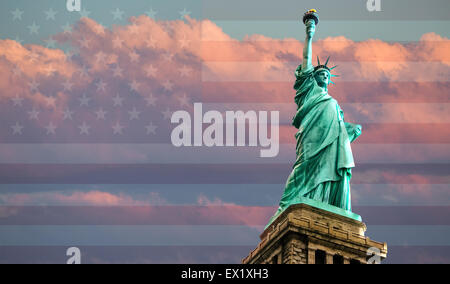 Statue of Liberty on American flag background against a cloudy sky at sunset, New York, USA Stock Photo