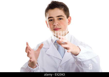 Boy dressed as a doctor in light blue tie and white coat helps to feel medicine more friendly: he making the gesture of moving hands as to reach viewers, catch something and drive to him. This means drive attention and give importance at the same time to Stock Photo