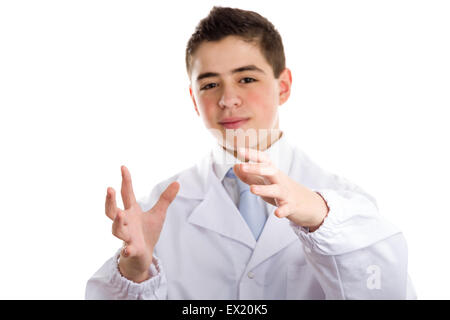 Boy dressed as a doctor in light blue tie and white coat helps to feel medicine more friendly: he making the gesture of moving hands as to reach viewers, catch something and drive to him. This means drive attention and give importance at the same time to Stock Photo