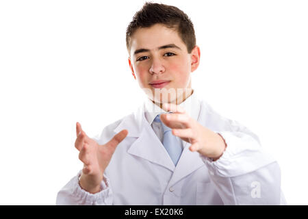 Boy dressed as a doctor in light blue tie and white coat helps to feel medicine more friendly: he making the gesture of moving hands as to reach viewers, catch something and drive to him. This means drive attention and give importance at the same time to Stock Photo