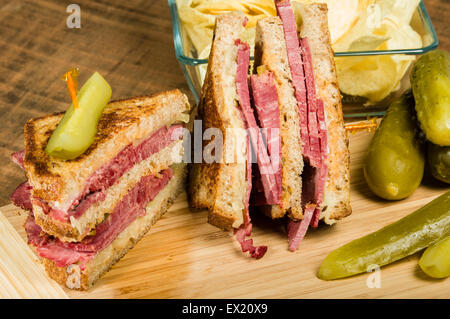 Grilled reuben sandwich with dill pickle spears Stock Photo