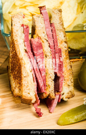 Grilled reuben sandwich with dill pickle spears Stock Photo