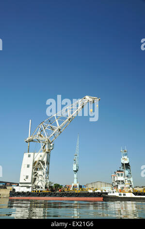 Harbour scene of floating crane moored to dock in port of Durban South Africa Stock Photo