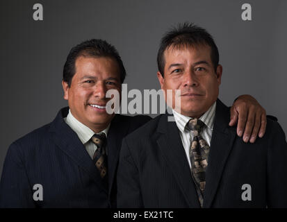 Hispanic business men smiling portrait Stock Photo