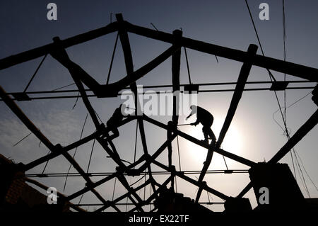 A labourer backouts an old building at a demolition site in Changzhi, Shanxi province January 29, 2010. VCP Stock Photo