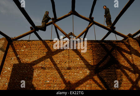 A labourer backouts an old building at a demolition site in Changzhi, Shanxi province January 29, 2010. VCP Stock Photo