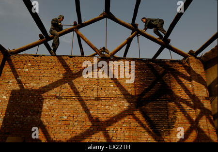 A labourer backouts an old building at a demolition site in Changzhi, Shanxi province January 29, 2010. VCP Stock Photo