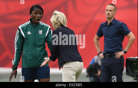 Edmonton, Canada. 04th July, 2015. Germany's head coach Silvia Neid (R) speaks with 4th official Gladys Lengwe during the FIFA Women's World Cup 2015 third place soccer match between England and Germany at the Commonwealth Stadium in Edmonton, Canada, 04 July 2015. Photo: Carmen Jaspersen/dpa/Alamy Live News Stock Photo