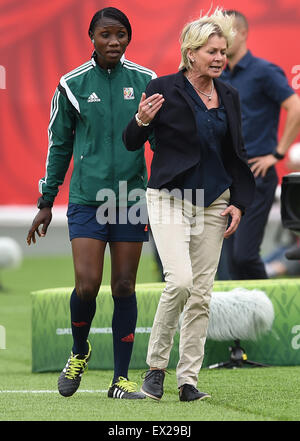 Edmonton, Canada. 04th July, 2015. Germany's head coach Silvia Neid (R) speaks with 4th official Gladys Lengwe during the FIFA Women's World Cup 2015 third place soccer match between England and Germany at the Commonwealth Stadium in Edmonton, Canada, 04 July 2015. Photo: Carmen Jaspersen/dpa/Alamy Live News Stock Photo