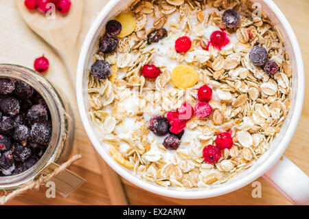 Bowl muesli with refrigerators with red and black currant top view Stock Photo