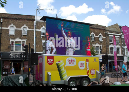 Wimbledon, London, UK. 5th July, 2015. Spectators watch Lewis Hamilton win Formula1 British Grand Prix at at Silverstone on a Big Screen in Wimbledon town centre Credit:  amer ghazzal/Alamy Live News Stock Photo