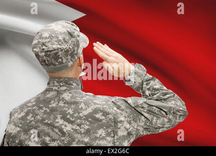 National military forces with flag on background conceptual series - Bahrain Stock Photo