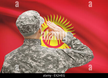 National military forces with flag on background conceptual series - Kyrgyzstan Stock Photo