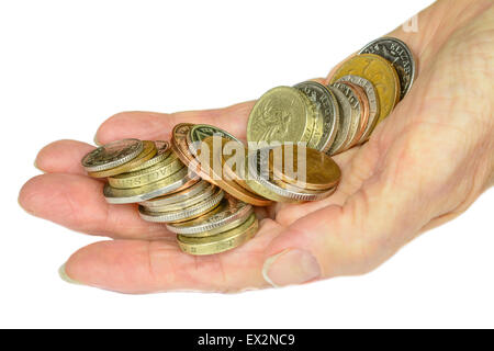 Woman's hand holding UK decimal sterling coins on a white background. Stock Photo