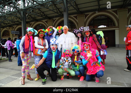 La Paz, Bolivia, 5th July 2015. A group of clowns pose for a photo with a life size cardboard cutout of Pope Francis at an event to celebrate his forthcoming visit to Bolivia. Pope Francis will visit La Paz on 8th July during his 3 day trip to Bolivia. Stock Photo