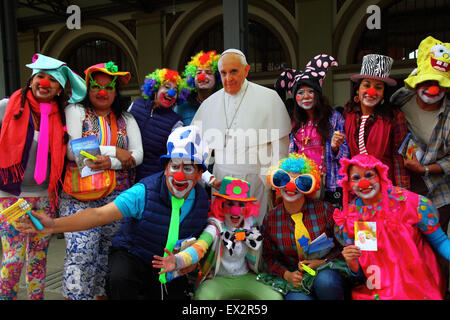 La Paz, Bolivia, 5th July 2015. A group of clowns pose for a photo with a life size cardboard cutout of Pope Francis at an event to celebrate his forthcoming visit to Bolivia. Pope Francis will visit La Paz on 8th July during his 3 day trip to Bolivia. Stock Photo