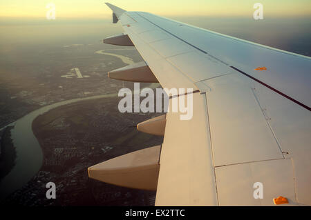 Germanwings Airbus A319 flying over the river Rhine in Leverkusen on approach to Cologne/Bonn airport, Germany. Stock Photo