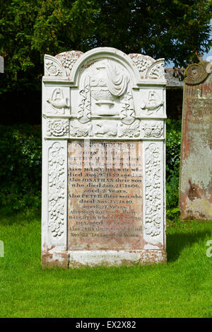 Gravestone of huntsman John Peel, in the churchyard of St Kentigern's Church, Caldbeck, Cumbria, England UK Stock Photo