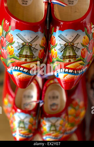 Dutch clogs or wooden shoes, decorated with a windmill and flowery design, Delft, South Holland, The Netherlands. Stock Photo