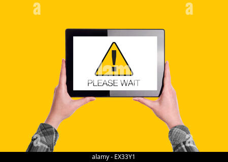Please Wait Message on Digital Tablet Computer Display, Woman Holding Device, Isolated on Yellow Background Stock Photo