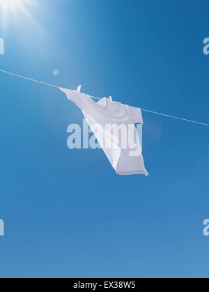 Laundry drying up on washing line Stock Photo