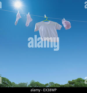 Laundry drying up on washing line Stock Photo