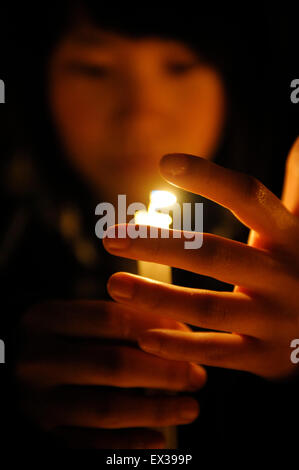 People mourn for victims of the April 14 Yushu Earthquake at a square ...