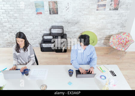 Japanese people working in modern office Stock Photo