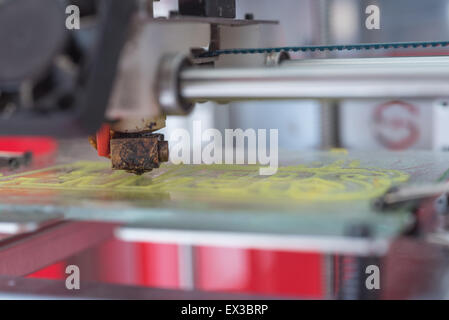 Yellow plastic piece printed in a 3D printer Stock Photo