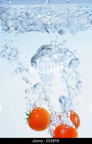 Tomatoes in water Stock Photo