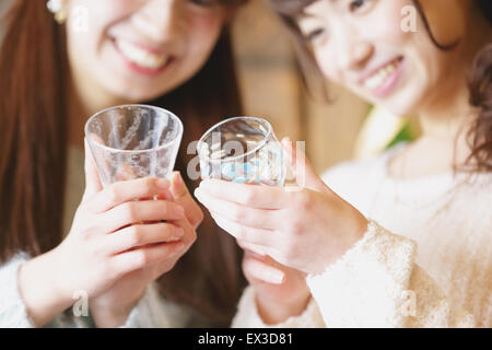 Young Japanese women enjoying visit to glass workshop in Kawagoe, Japan Stock Photo