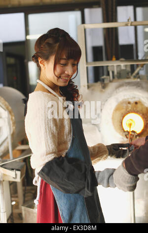 Young Japanese woman enjoying glass crafting workshop in Kawagoe, Japan Stock Photo