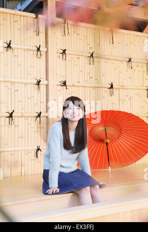 Young Japanese woman enjoying foot spa in Kawagoe, Japan Stock Photo