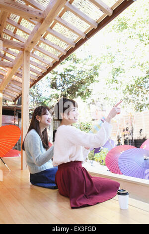 Young Japanese women enjoying foot spa in Kawagoe, Japan Stock Photo