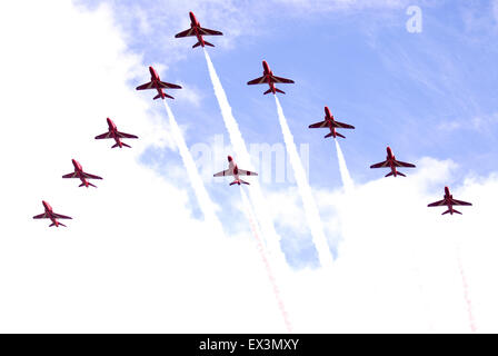 RAFs Red Arrows on a flypast during the Farewell to the Garrison Festival, Bordon, Hampshire, UK. Saturday 27 June 2015. Stock Photo