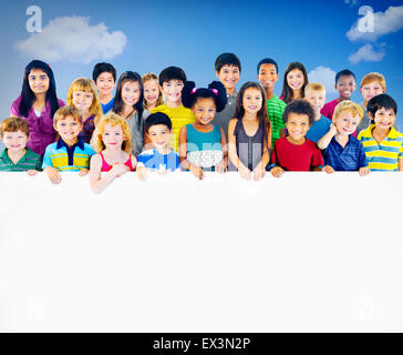 Multi-Ethnic Group of Children Holding Empty Billboard Stock Photo