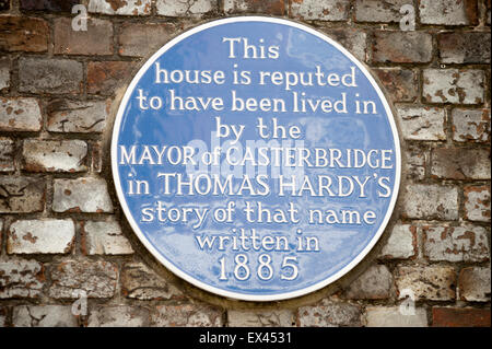 Plaque identifying location of the fictional Mayor of Casterbridge's house on a wall  in Dorchester, Dorset, England, UK. Stock Photo