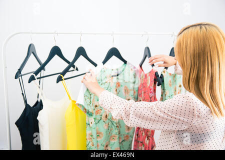 Young woman choosing cloth Stock Photo