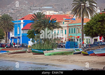 Fishing boats on beach along waterfront of old colonial historic center of the city Mindelo on São Vicente, Cape Verde, Africa Stock Photo