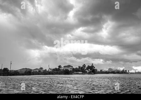 Dark clouds hovering over the water before a heavy storm in Cape Coral, Florida Stock Photo